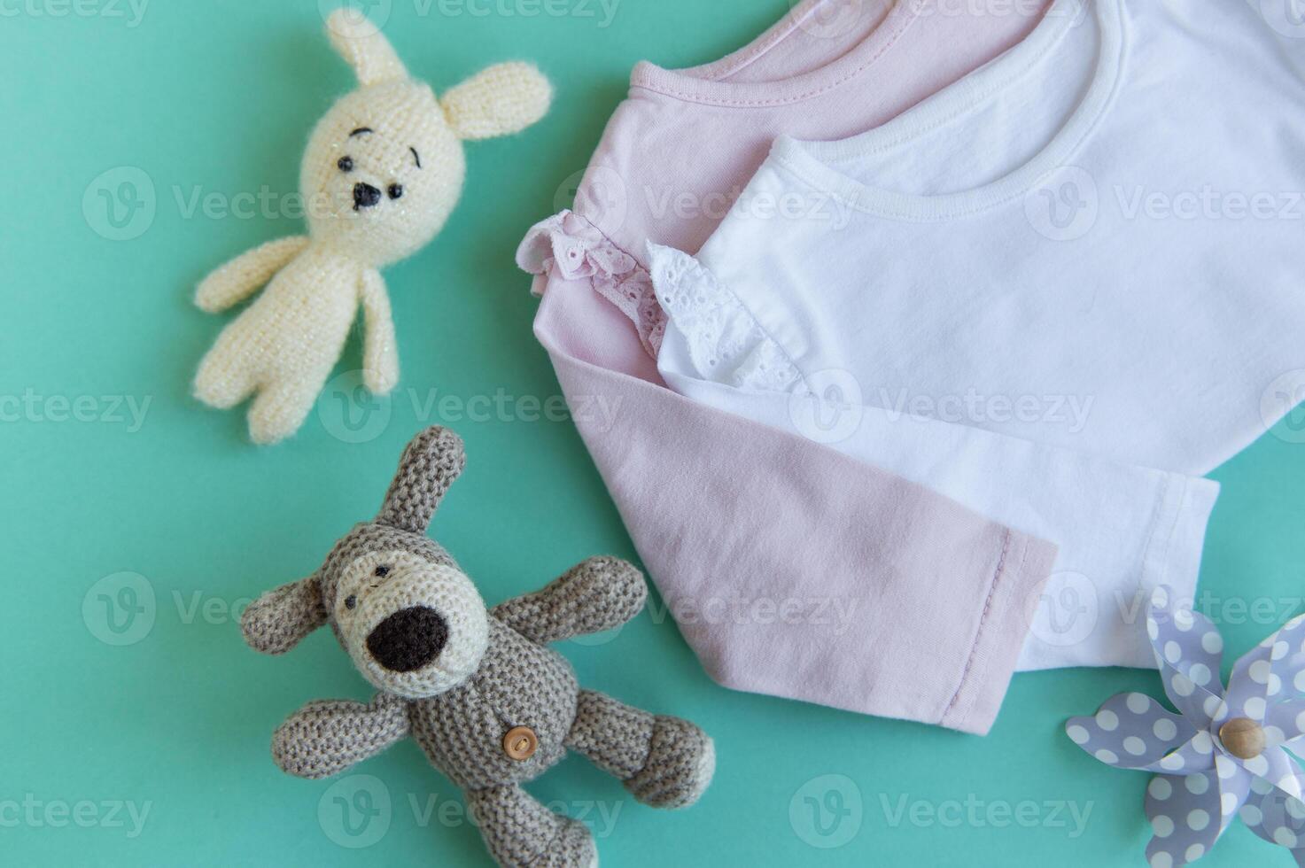 Set of pink clothes and accessories for newborn baby. photo
