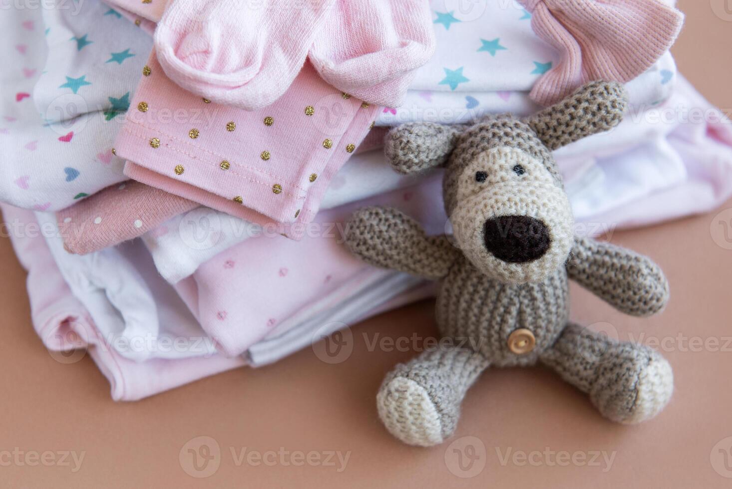 Stack of Baby bodysuits. photo