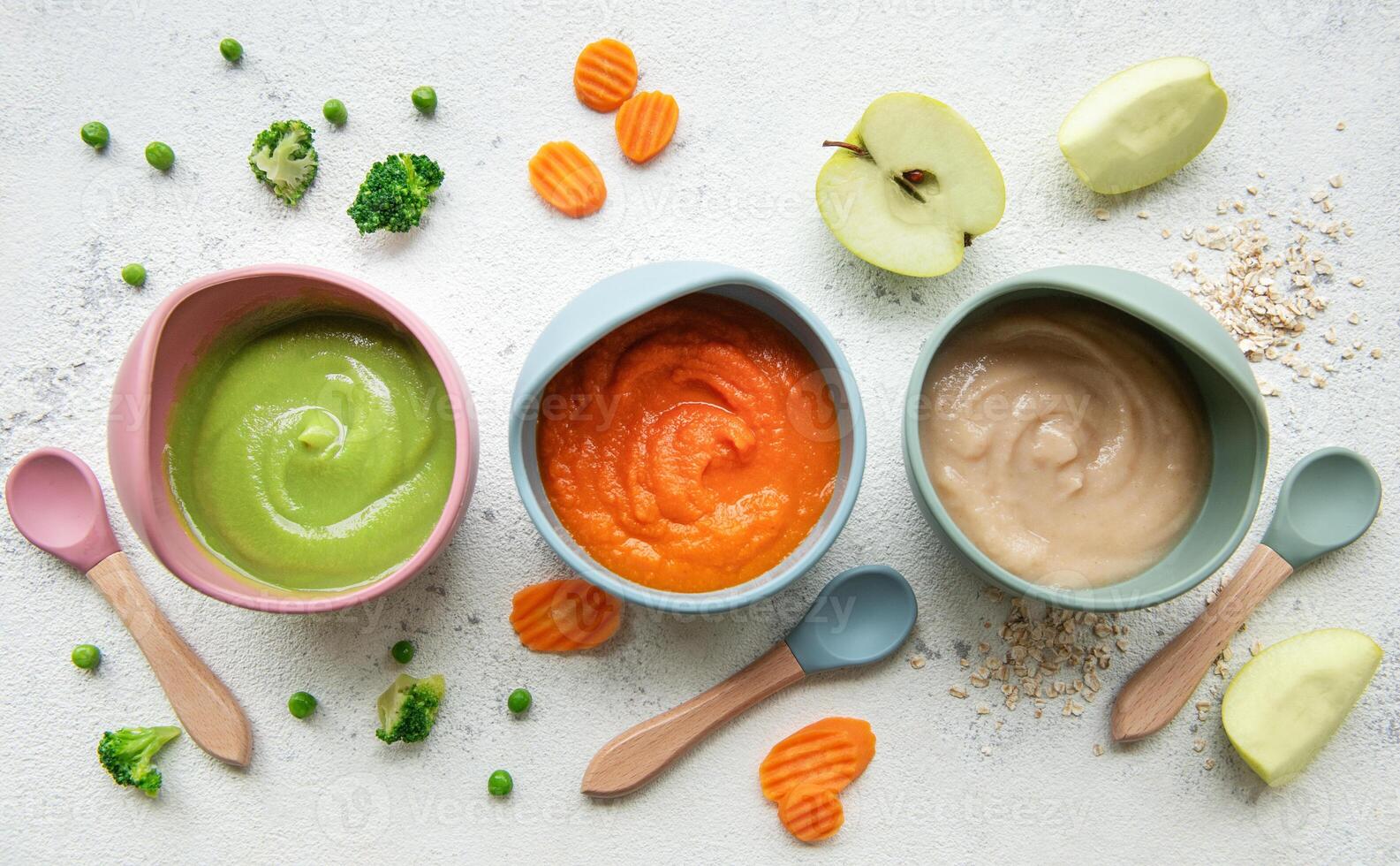 Healthy baby food in bowls photo