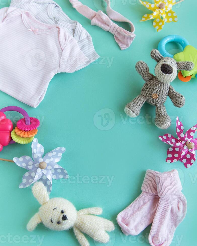 Set of pink clothes and accessories for newborn baby. photo
