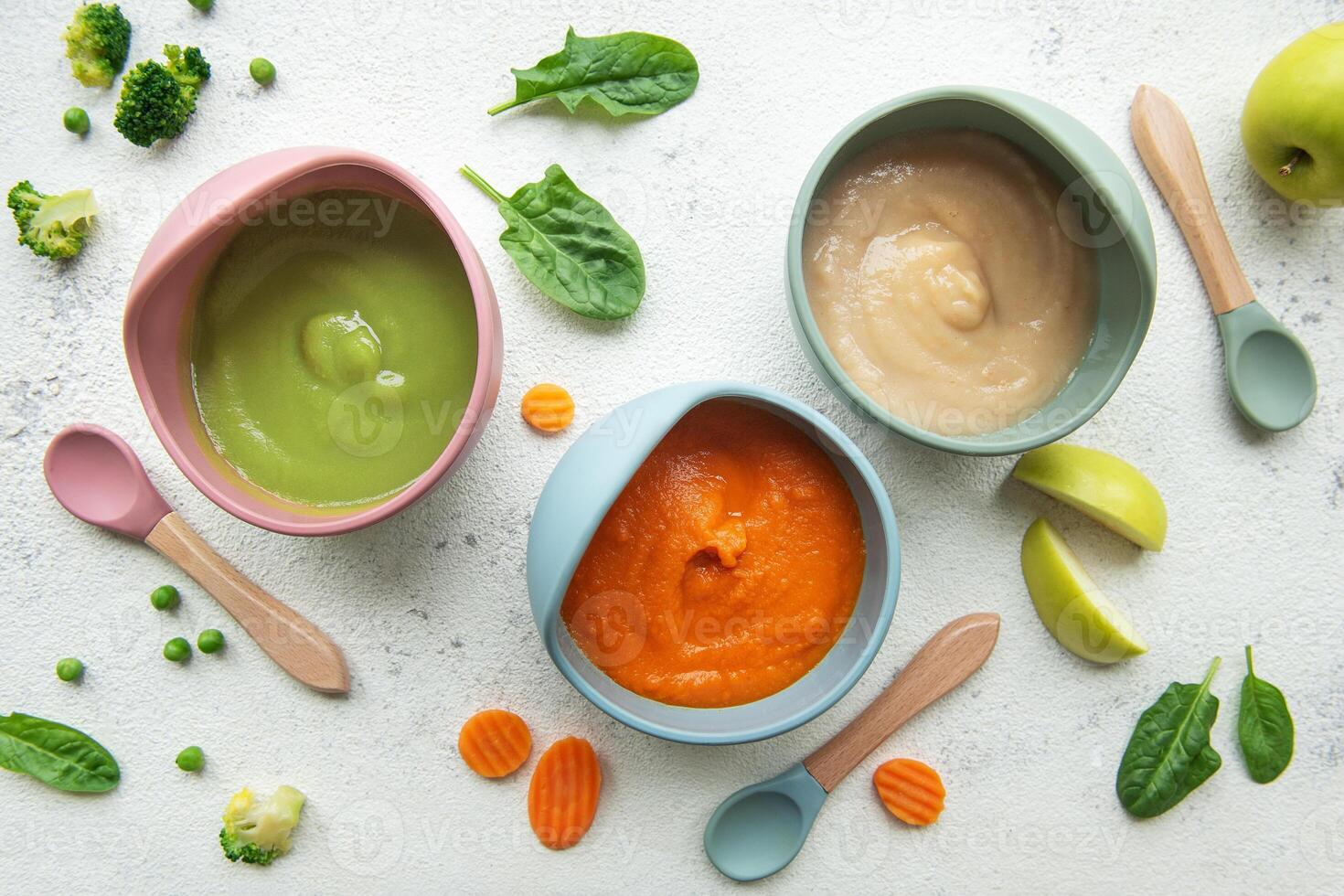 Healthy baby food in bowls photo