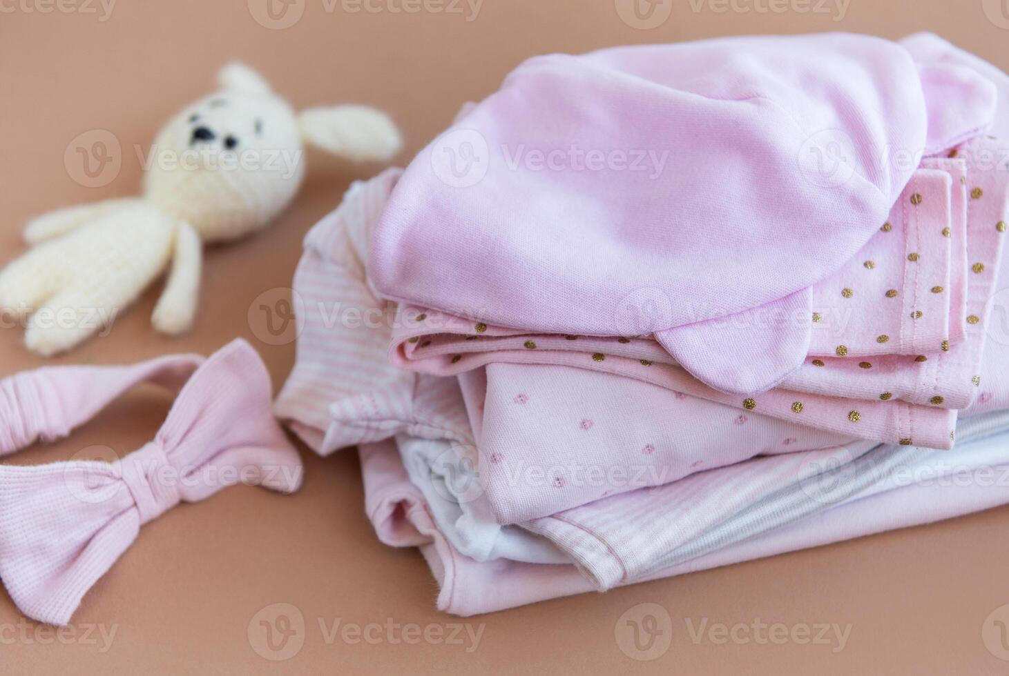 Stack of Baby bodysuits. photo