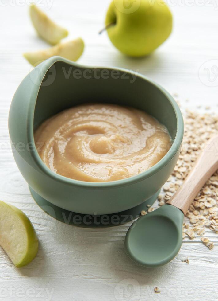 A bowl of porridge for baby. photo