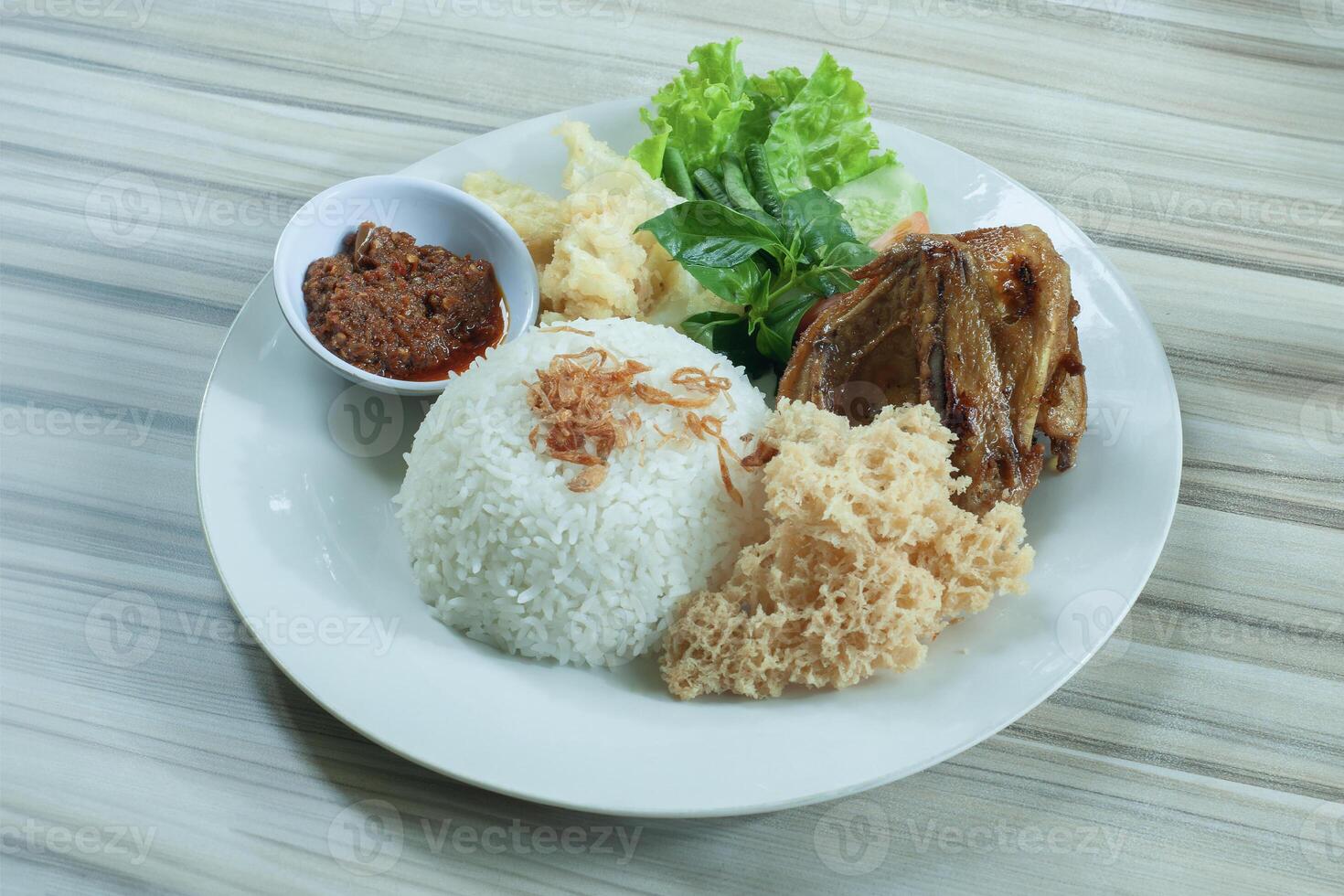 Nasi Bebek Kremes or Crunchy fried duck photo