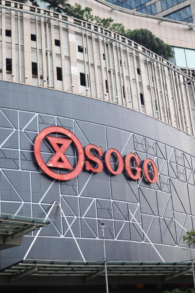Sogo logo on the outside wall of a mall. surabaya, indonesia - 21 february 2024 photo