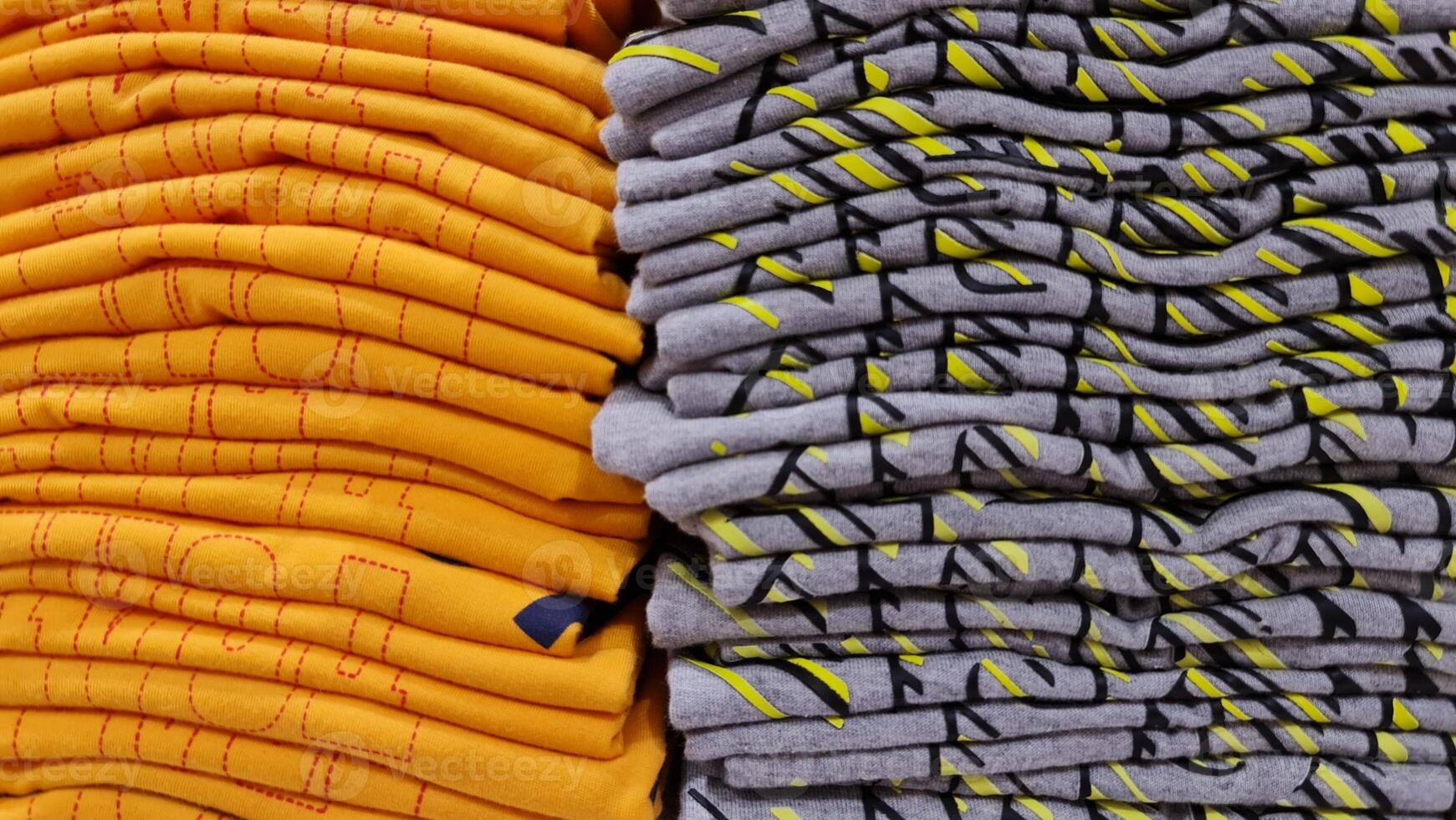 A pile of children's clothes in a clothing store. Discount cotton clothing. photo
