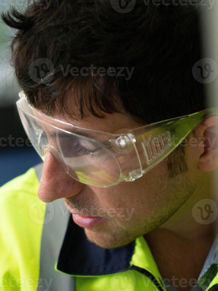 man male person people human close up face wear glasses goggle safety equipment protection factory work job occupation industry engineer technology business young adult production development eyeglass photo