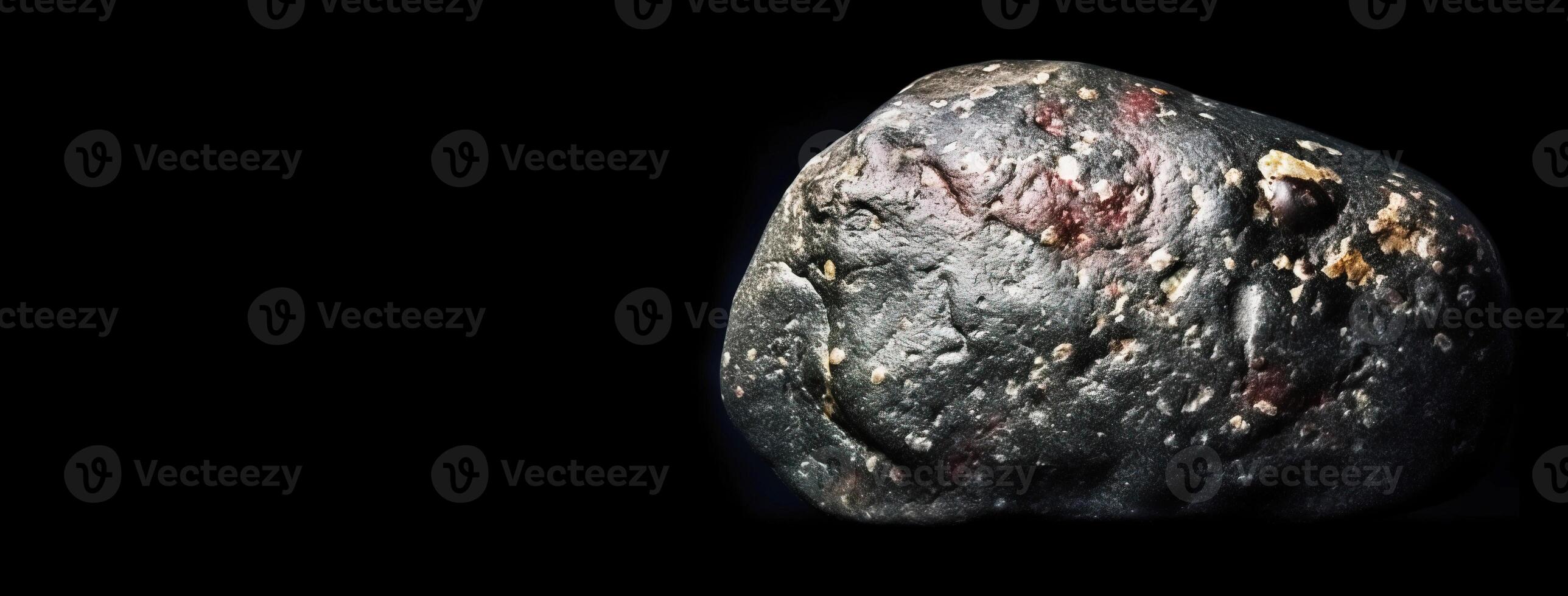 Wairakite fossil mineral stone. Geological crystalline fossil. Dark background close-up. photo