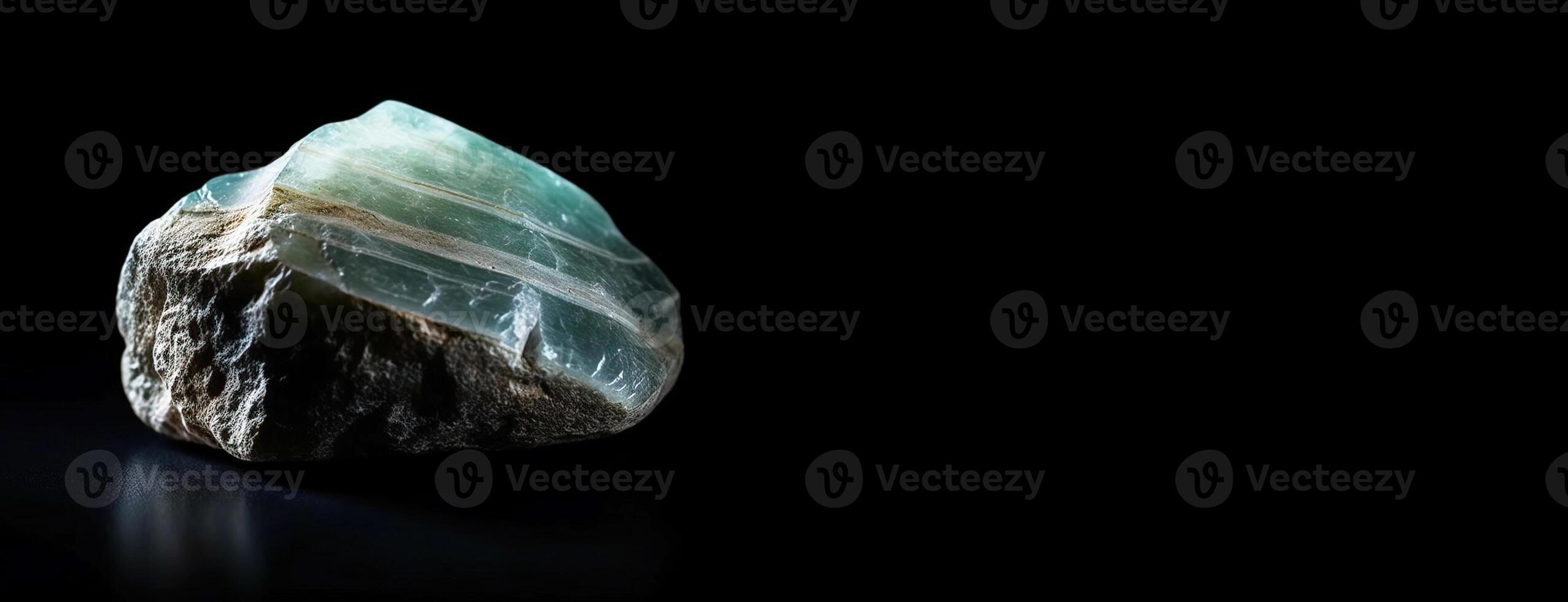 Kerolite is a rare precious natural stone on a black background. . Header banner mockup with space. photo