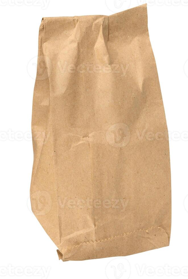 Brown kraft paper bag for packaging products in stores on an isolated background photo