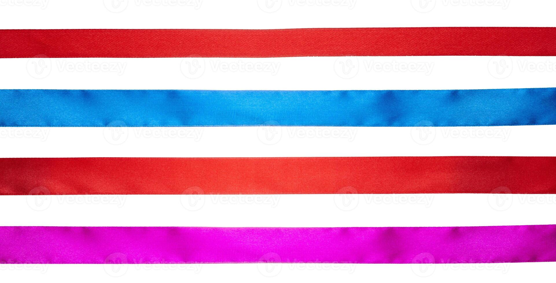 Red, blue and pink silk ribbons on isolated background photo