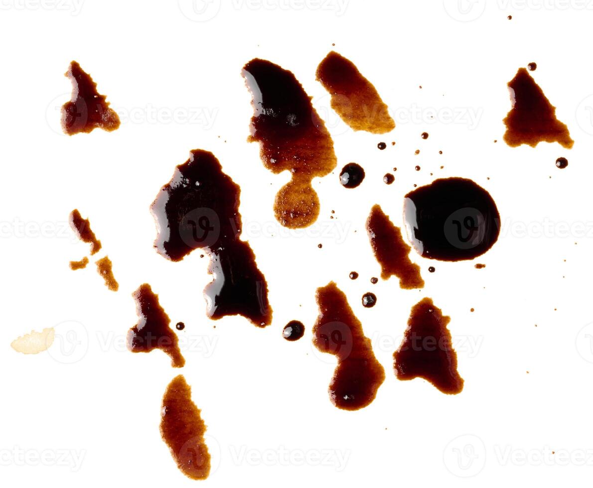 Spilled black coffee, splashes on a white background photo