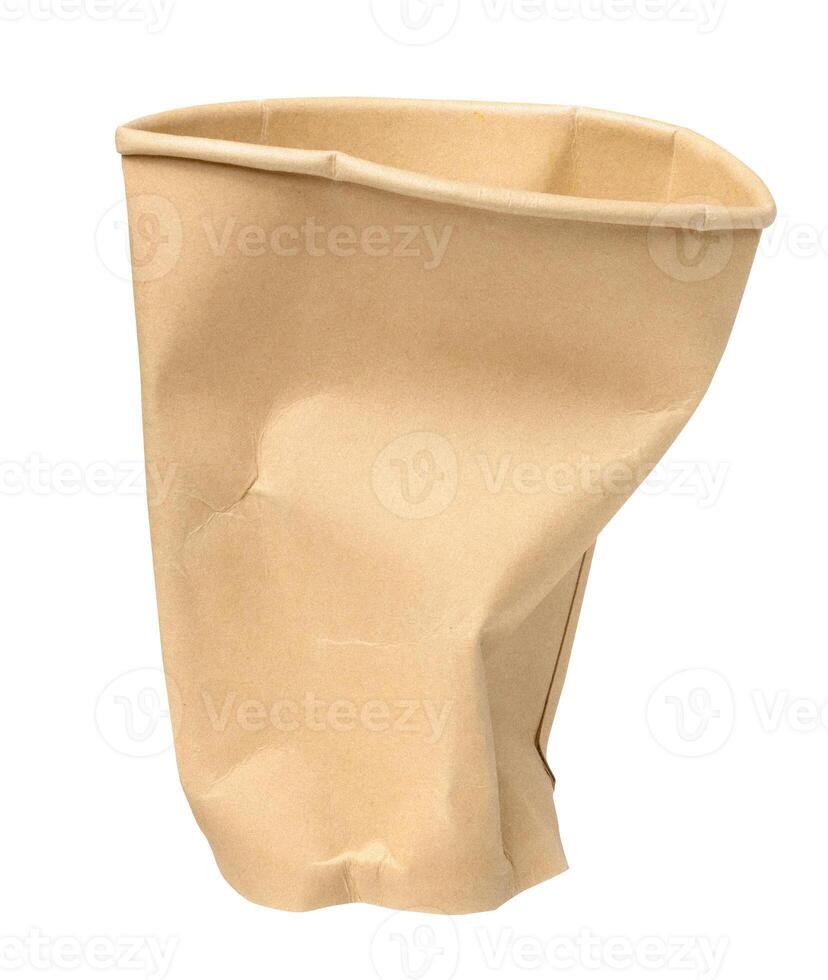 Paper brown crumpled cup on isolated background photo