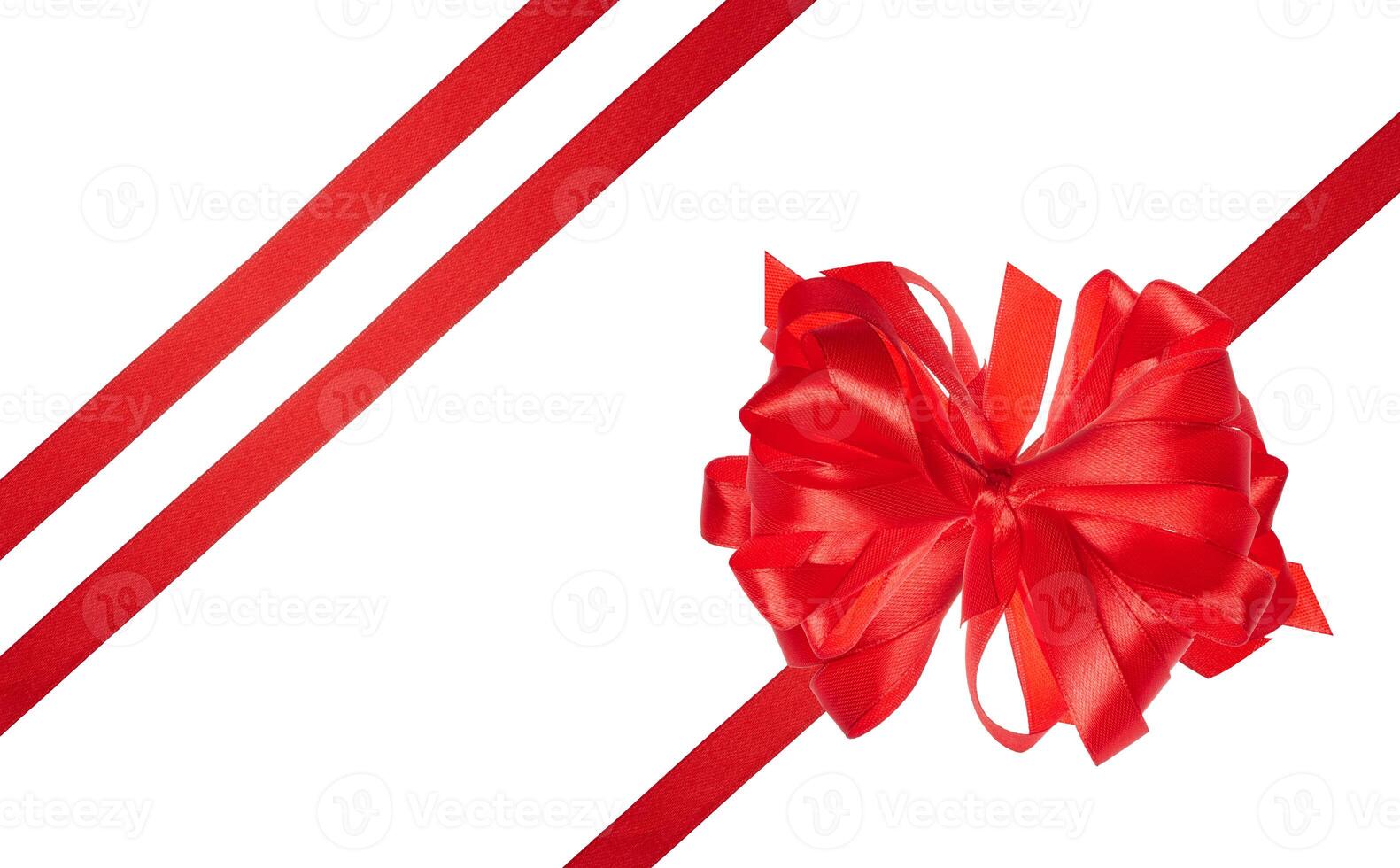 Tied bow made of red silk ribbon on an isolated background, decor for a gift photo