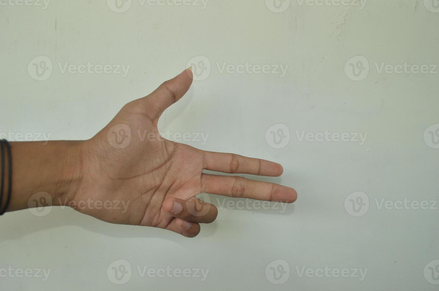 Man's hand isolated on white background. male hand gestures with various movements. Close-up of an elegant palm facing upwards with space for your product. various hand gestures photo