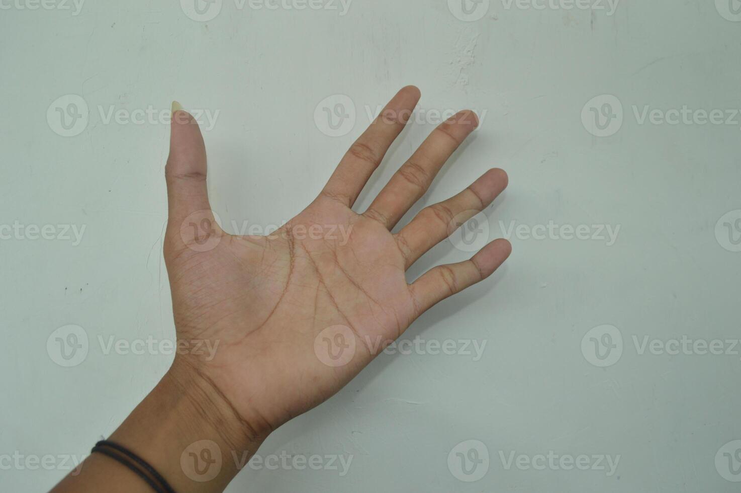 Man's hand isolated on white background. male hand gestures with various movements. Close-up of an elegant palm facing upwards with space for your product. various hand gestures photo
