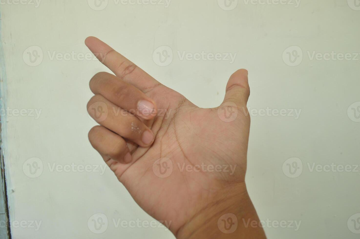 Man's hand isolated on white background. male hand gestures with various movements. Close-up of an elegant palm facing upwards with space for your product. various hand gestures photo