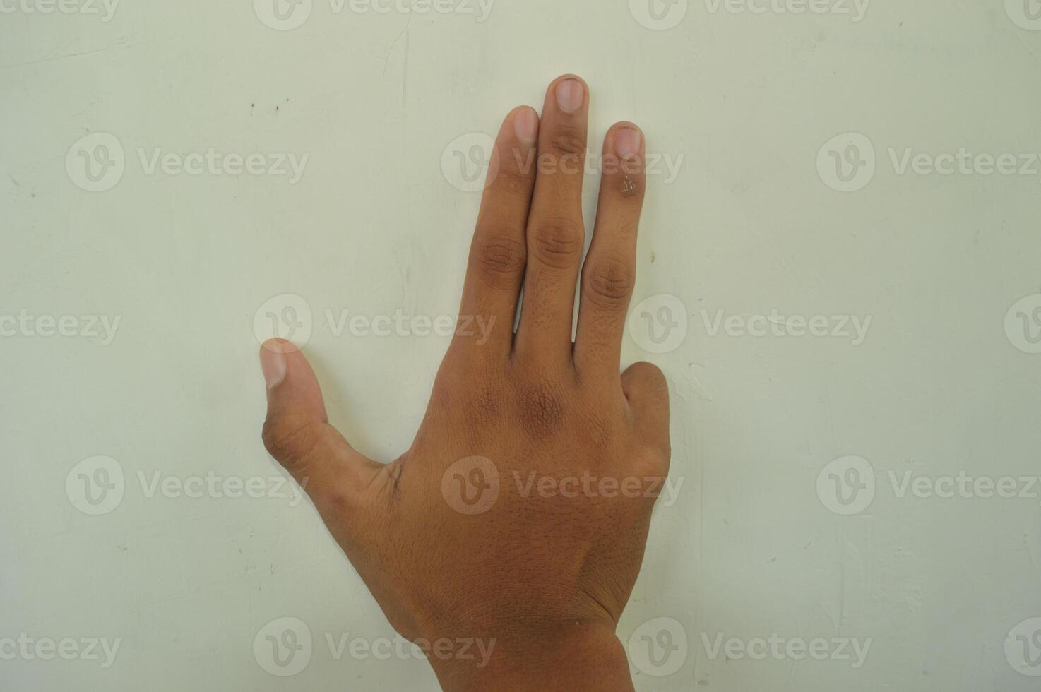 Man's hand isolated on white background. male hand gestures with various movements. Close-up of an elegant palm facing upwards with space for your product. various hand gestures photo