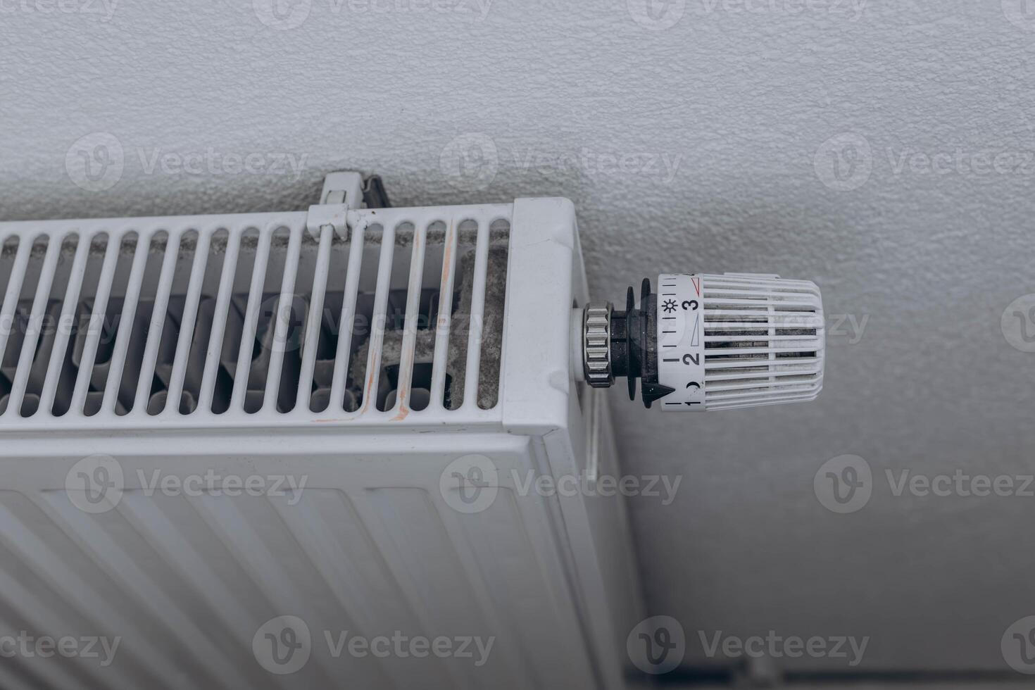 Radiator in the apartment. Saving heating photo