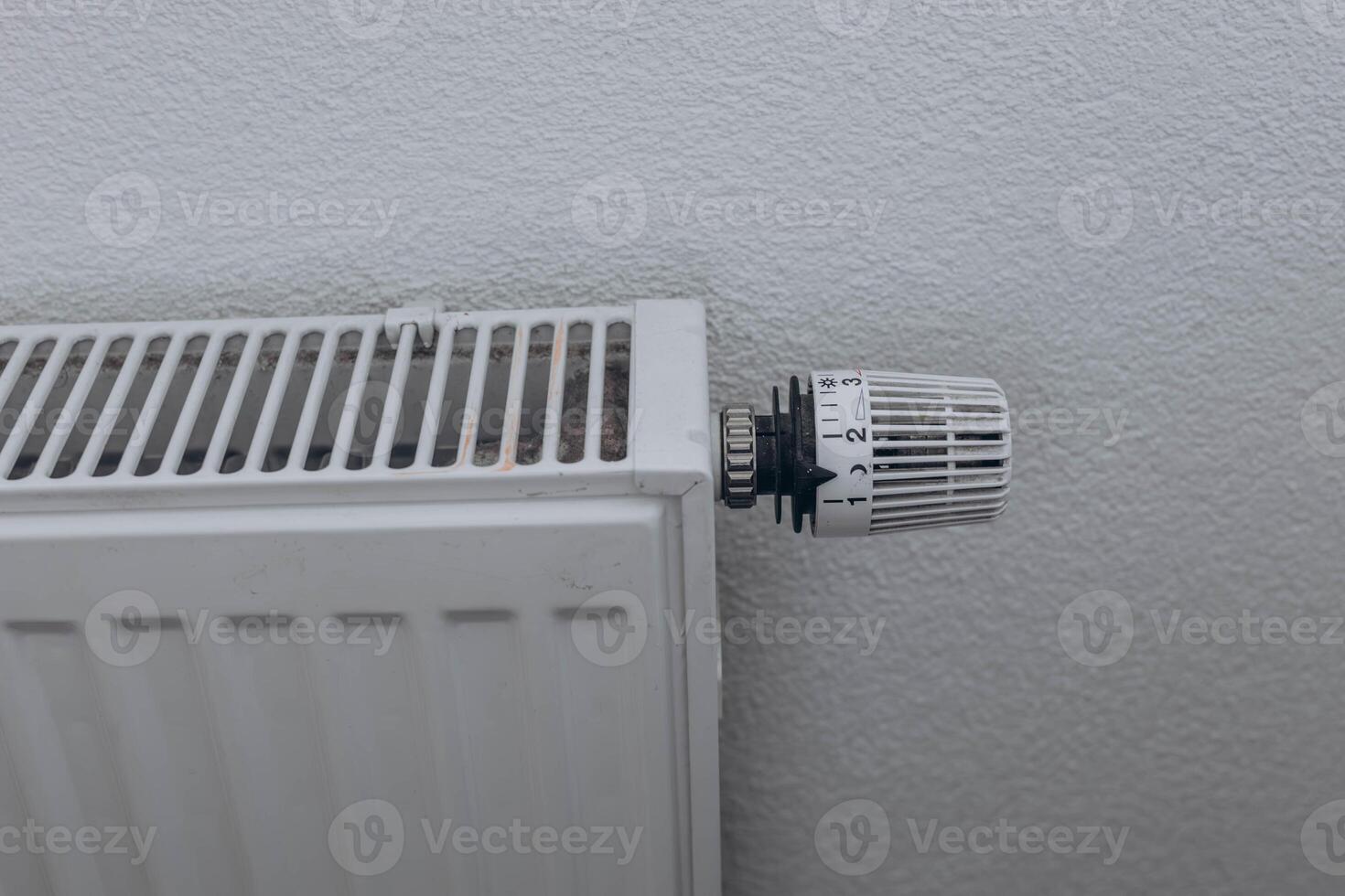 Radiator in the apartment. Saving heating photo