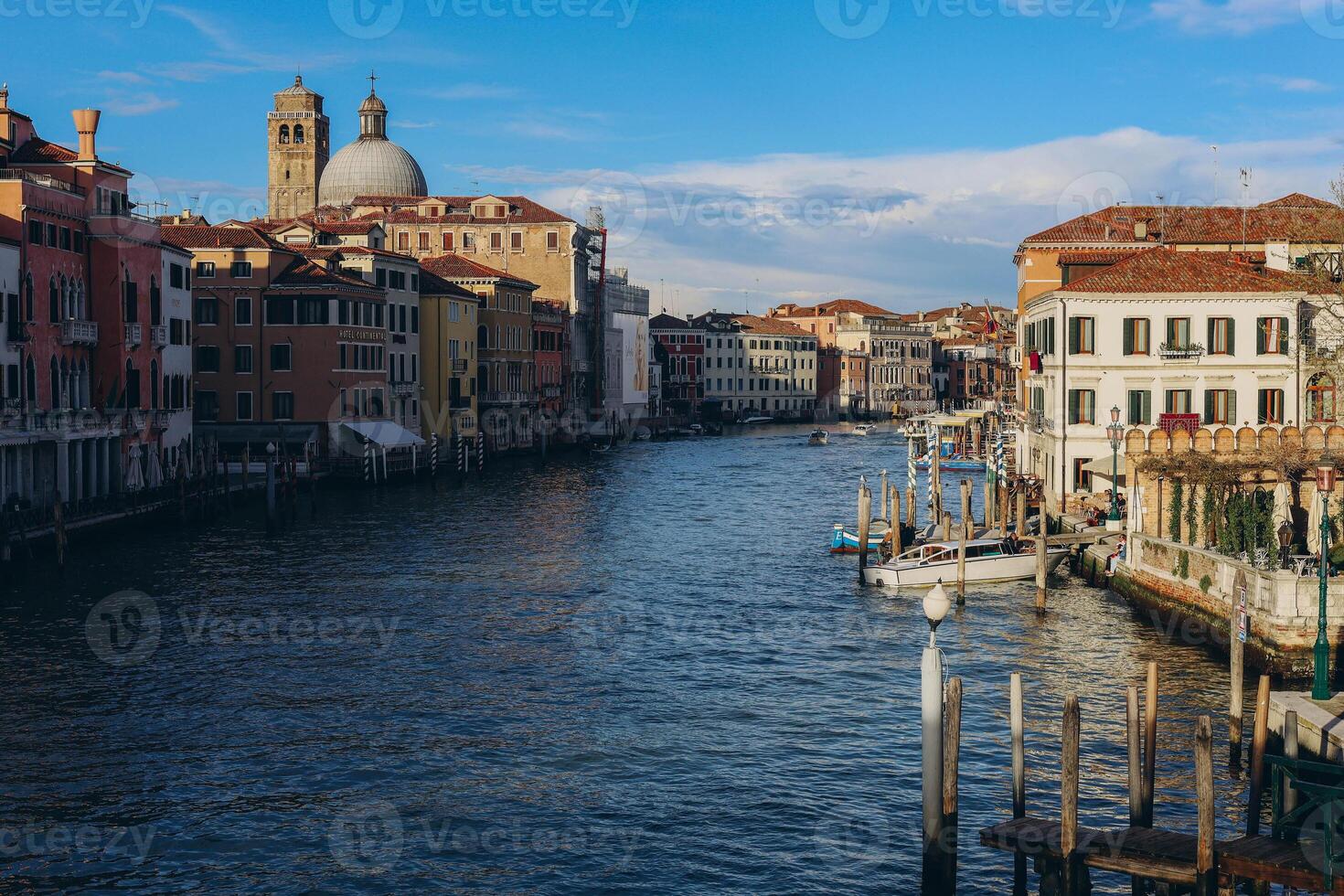 Venice, Italy - april 2,2023. Venice Grand Canal, view of the Rialto Bridge and gondoliers photo