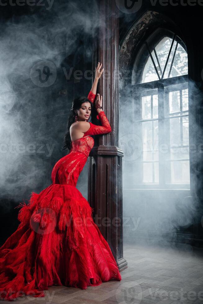 Woman Vintage Red Dress Old Castle Beautiful Princess In Seductive Dress photo