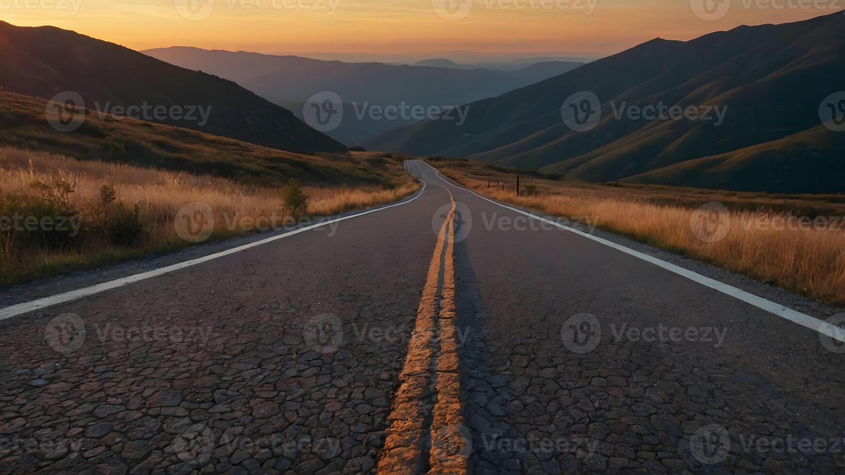 Asphalt road in the mountains at sunset. Beautiful nature landscape. photo