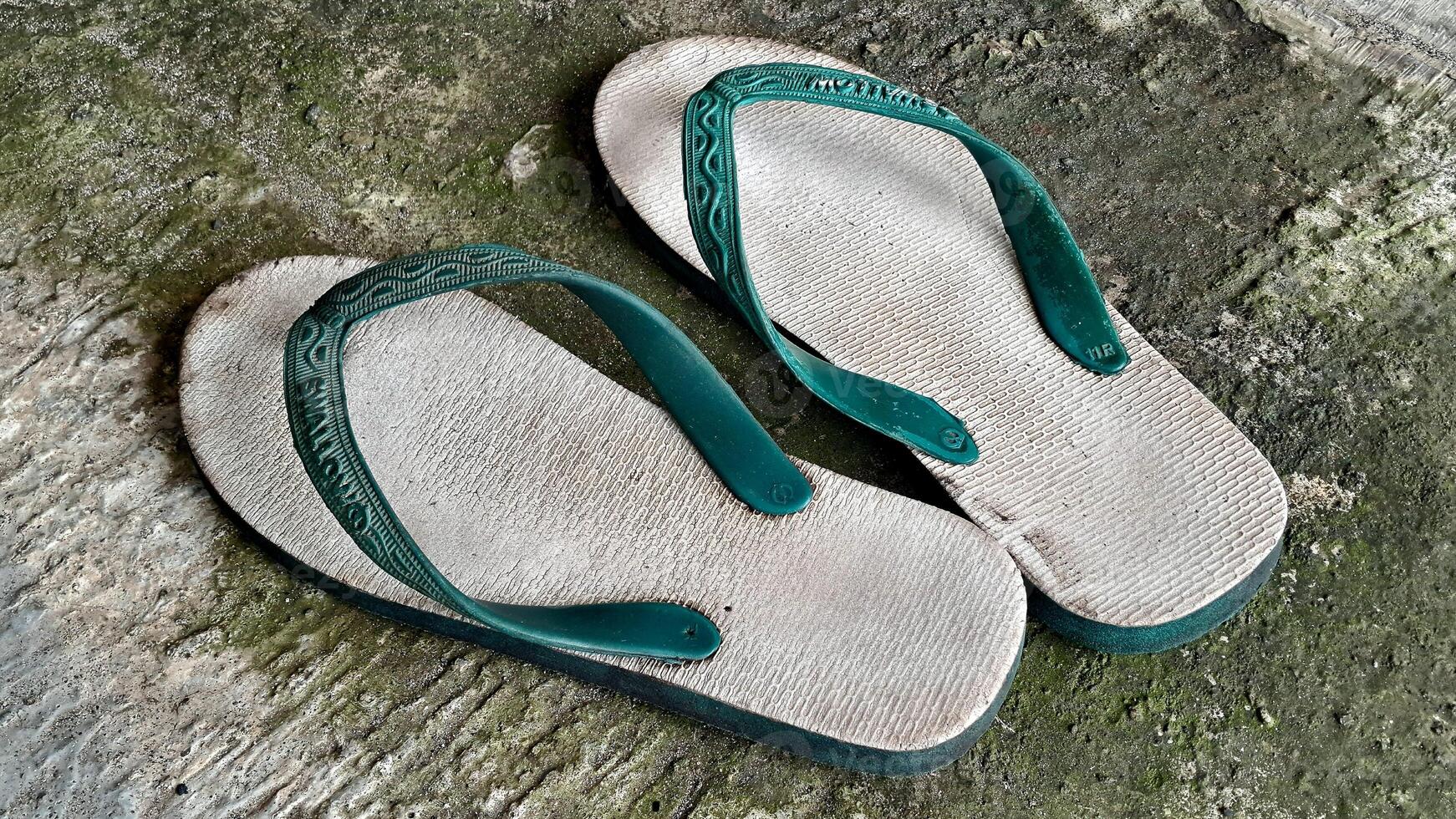 Flip flops hipster concept on plaster background, sendals indonesia Surabaya photo