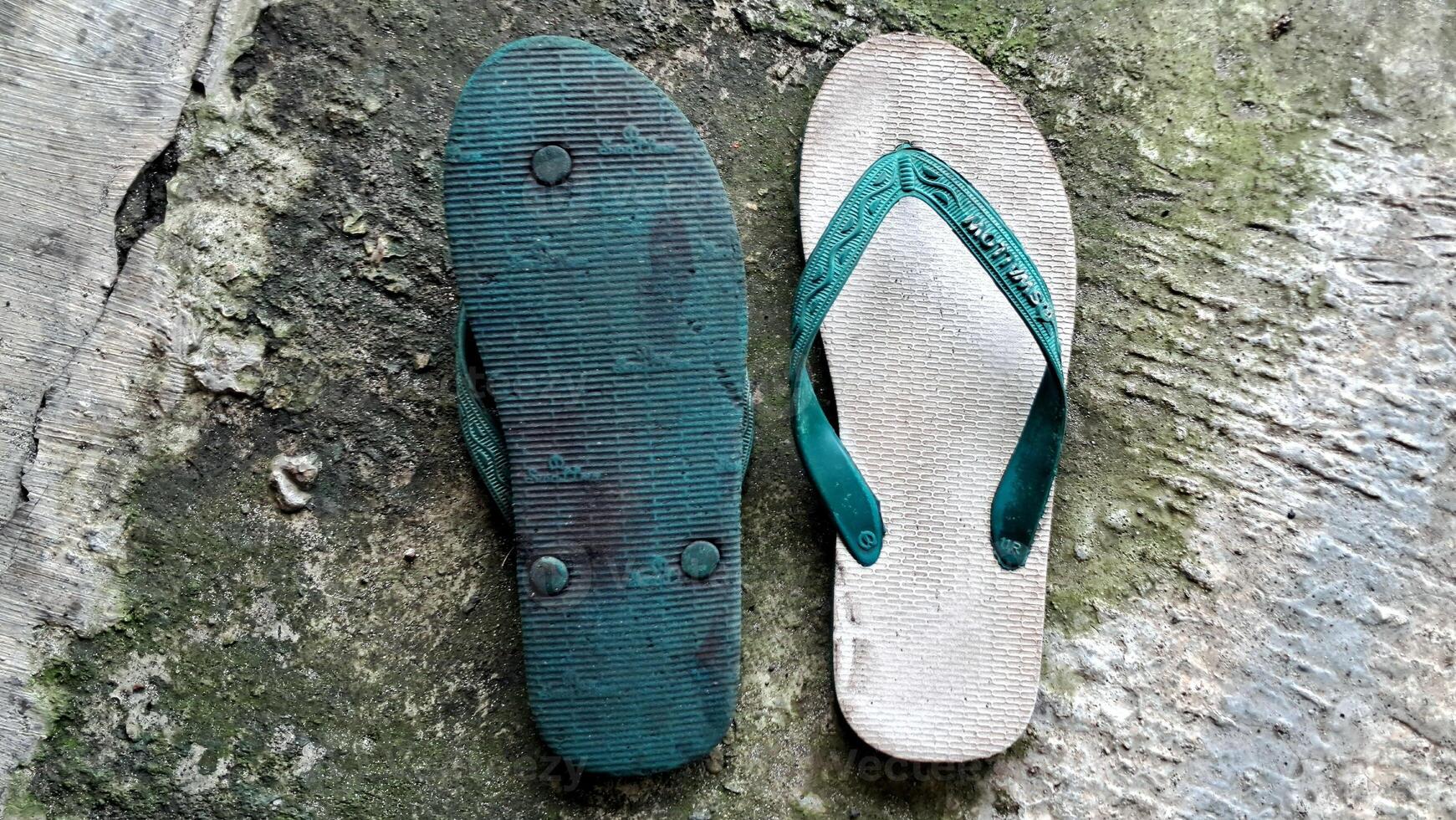 Flip flops hipster concept on plaster background, sendals indonesia Surabaya photo