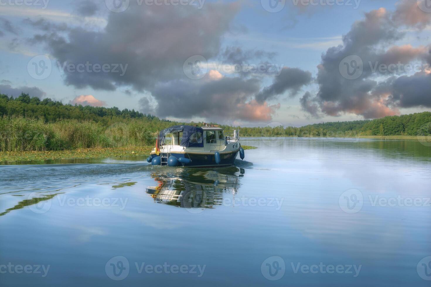 Motorboat on Boat Trip in Mueritz National Park, Mecklenburg Lake District,Germany photo