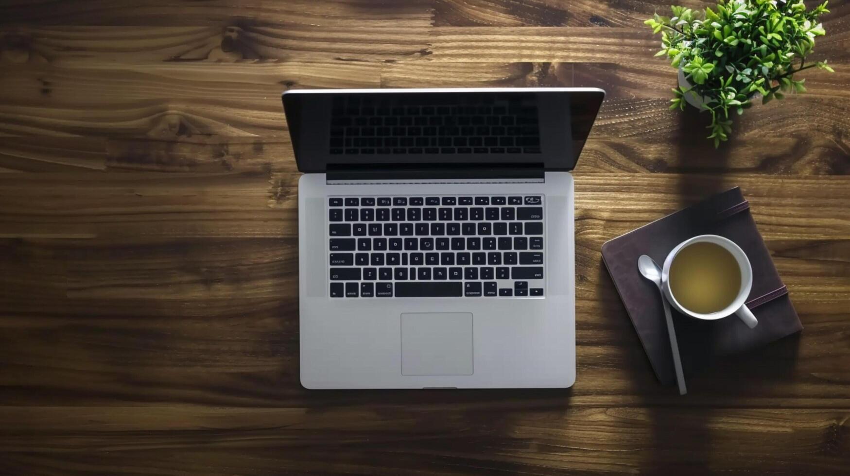 aerial view of computer laptop on wooden table photo