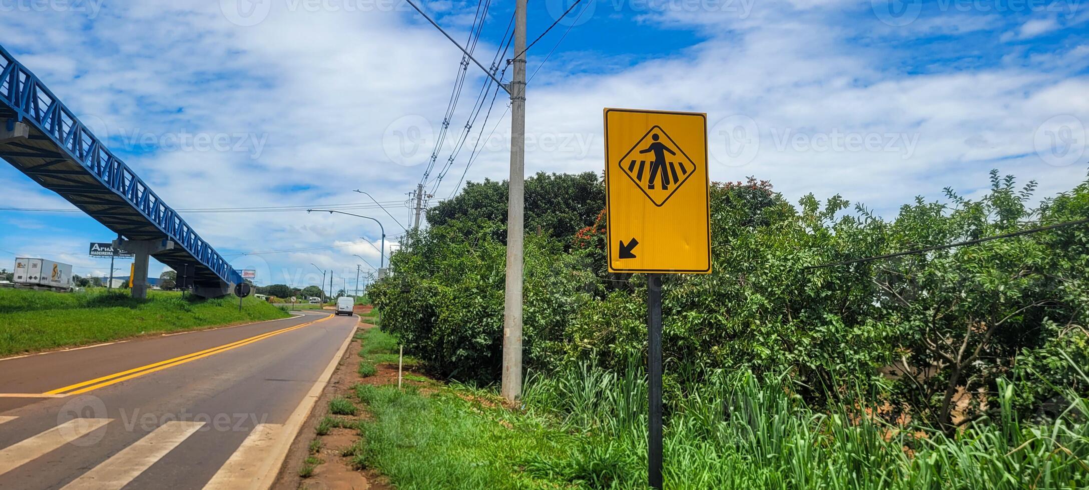 pedestrian sign on paved road photo