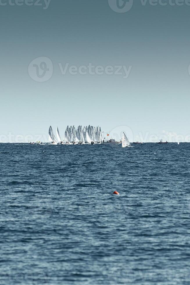 A lot of sail boats and yachts in the sea went on a sailing trip near port Hercules in Monaco, Monte Carlo, sail regatta, race photo
