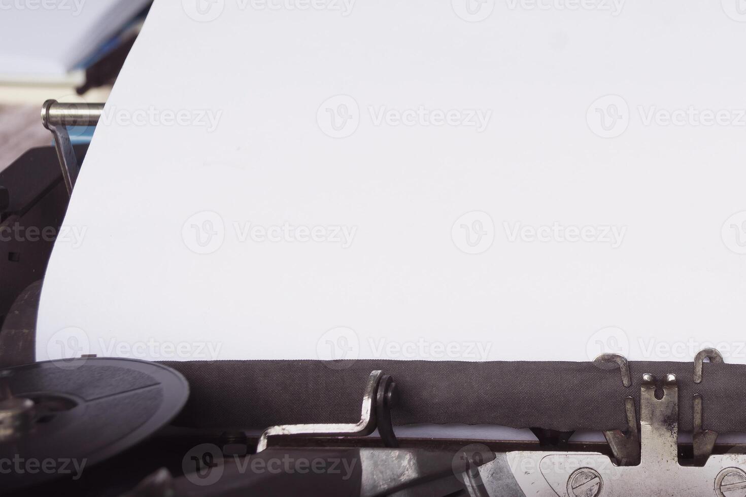 Blue typewriter with paper sheet. Space for your text. photo