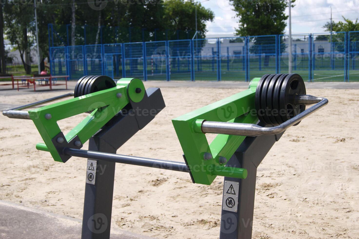 Weight plates on green equipment. photo