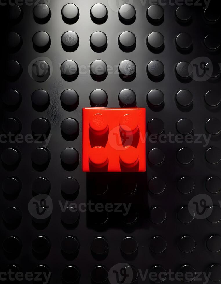 Isolated Red Puzzle Toy on a High Contrast Black Board Background photo