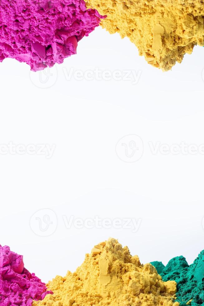 Multicolored holi powder isolated on white background photo