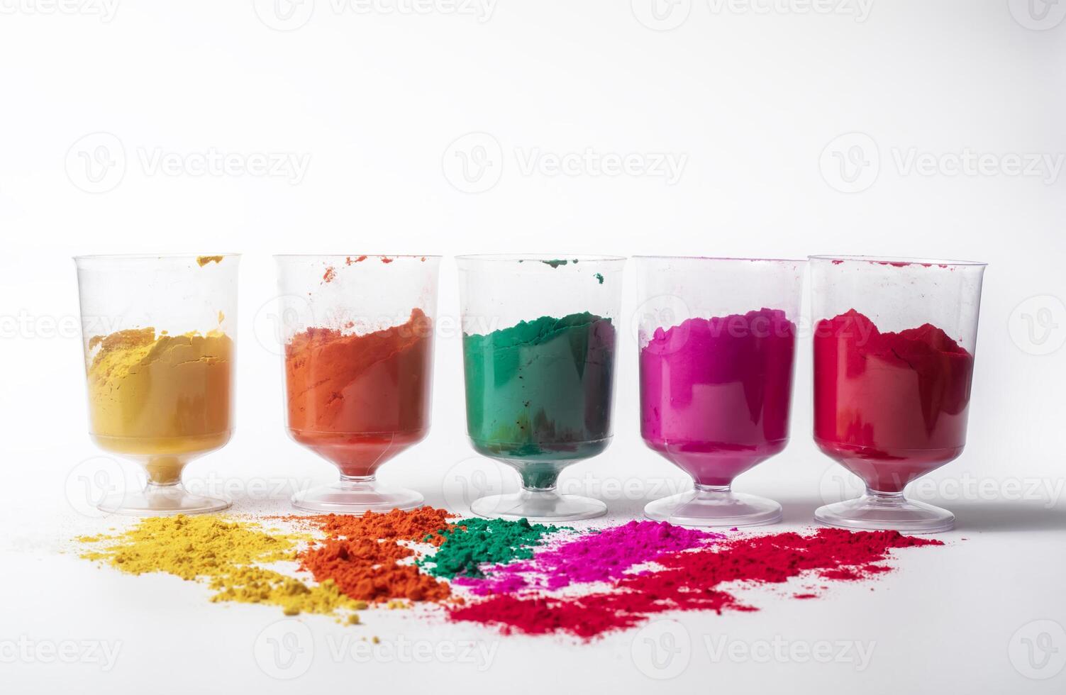 Colorful holi powder in glass bowl on white background. festival of colors photo