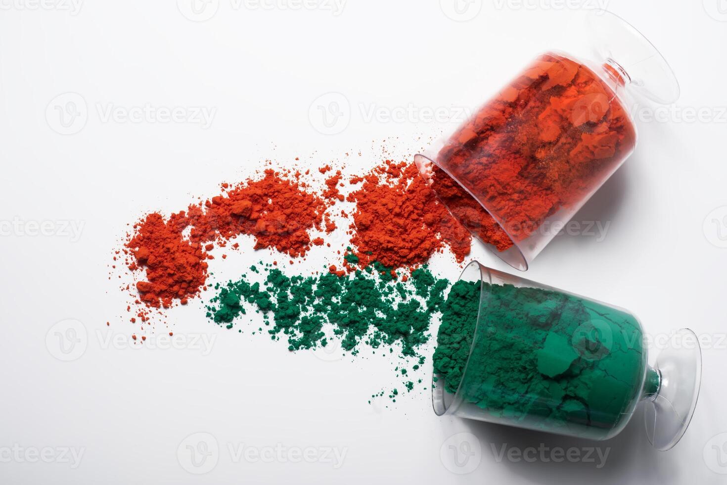 Colorful holi powder in glass isolated on white background. photo