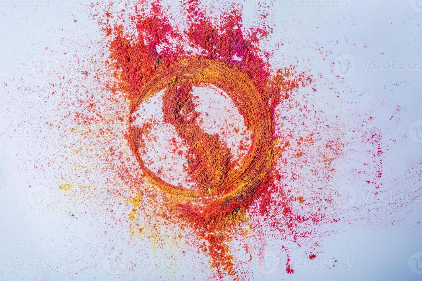 Multicolored holi powder in the form of a circle on a white background. photo