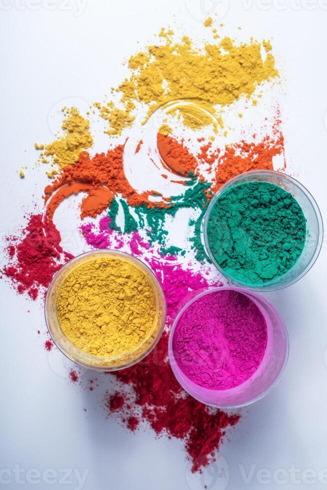 Colorful holi powder in glass bowl isolated on white background. photo