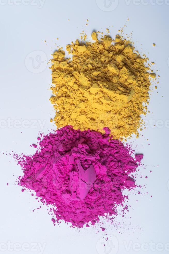 Pile of colorful holi powder isolated on white background. photo