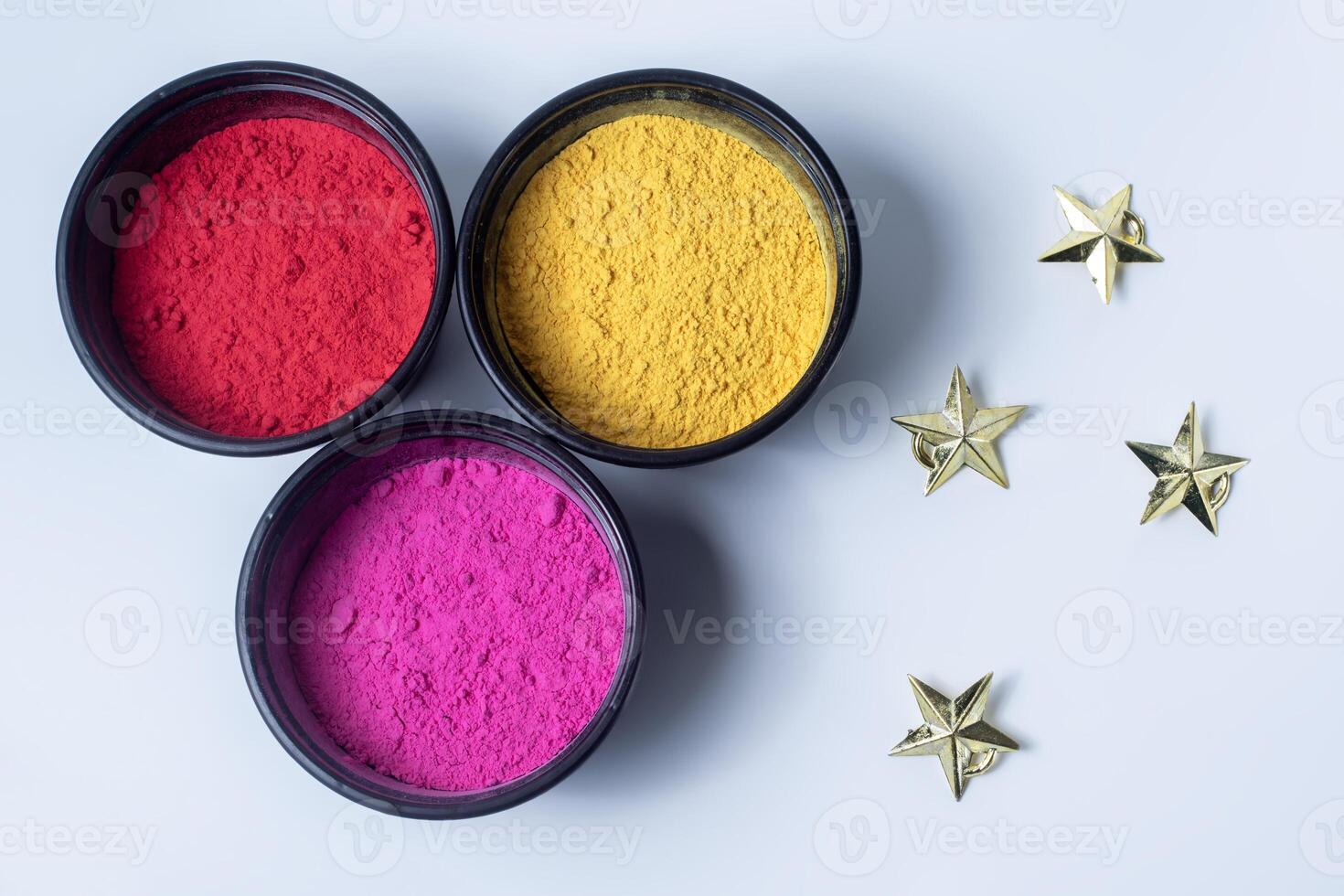 Indian Festival Holi background with colorful powder and golden star. photo