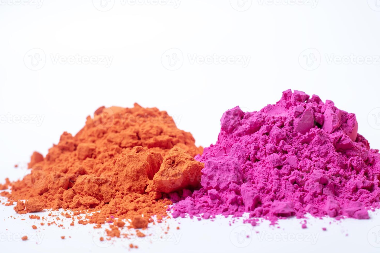 Pile of colorful holi powder isolated on white background. photo