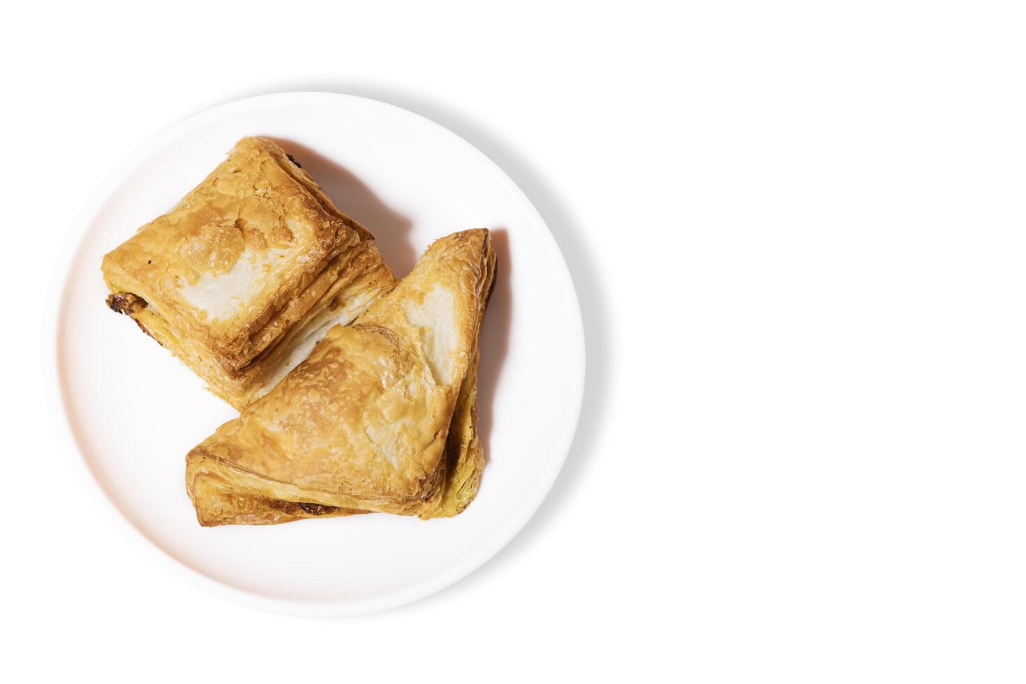 Vegetable Puff Pastry on white plate isolated on white background photo