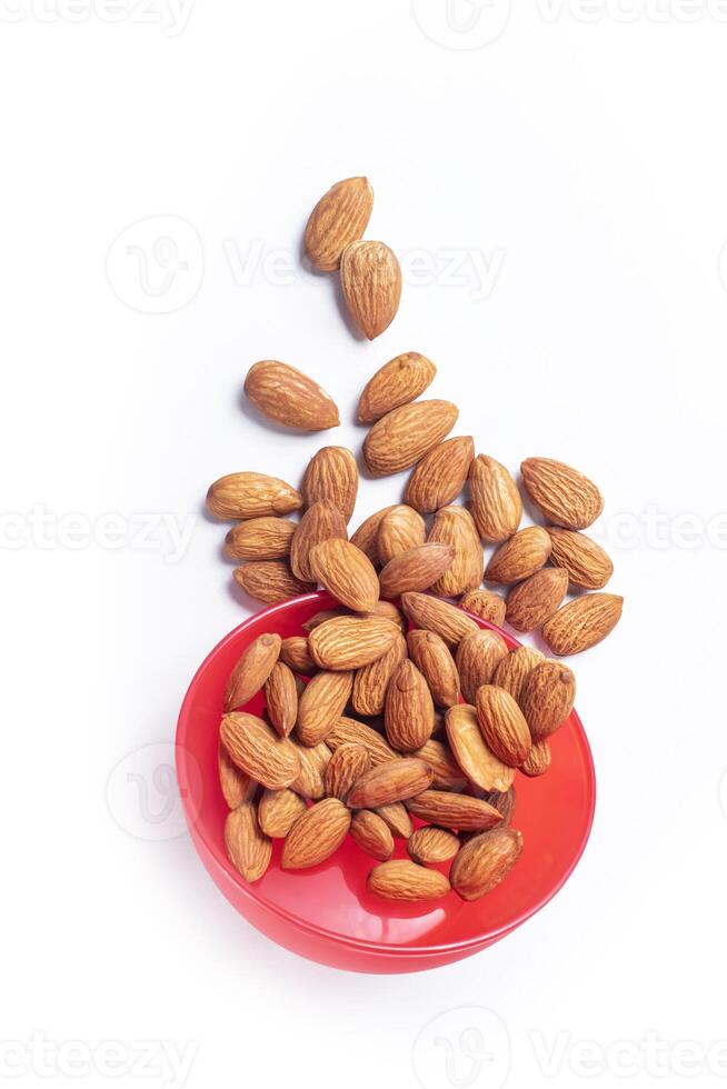 Falling almond isolated on white background with clipping path. Healthy food concept. photo