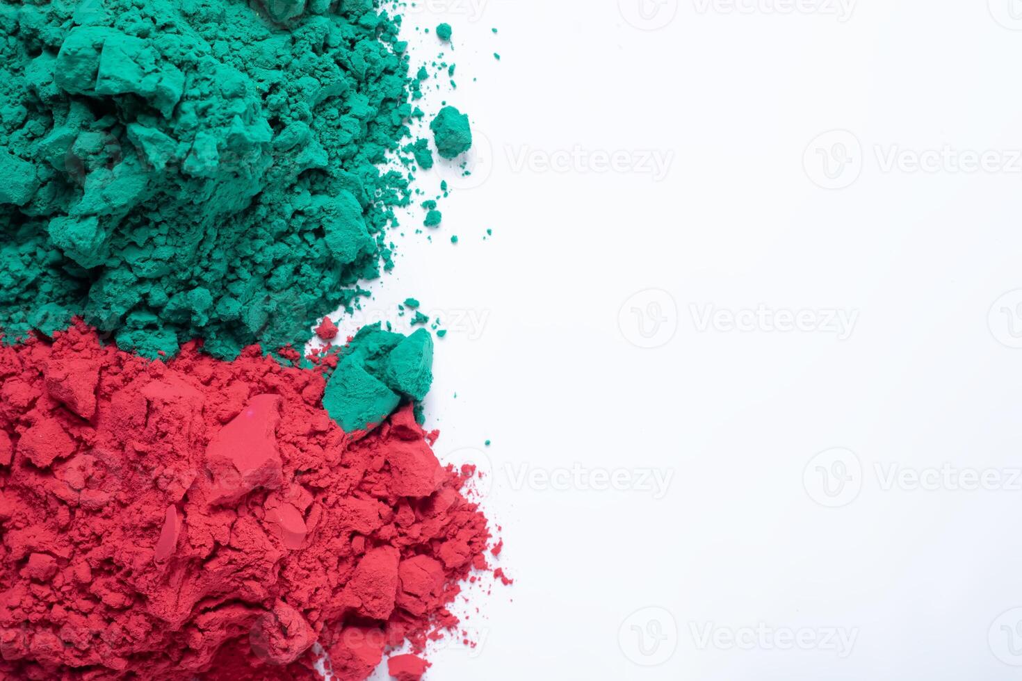Pile of colorful holi powder isolated on white background. photo