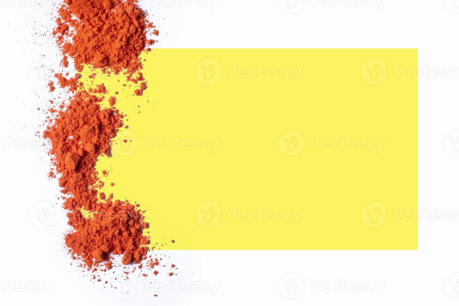 Yellow frame on white background with red holi powder on it. Holi Greeting Card photo