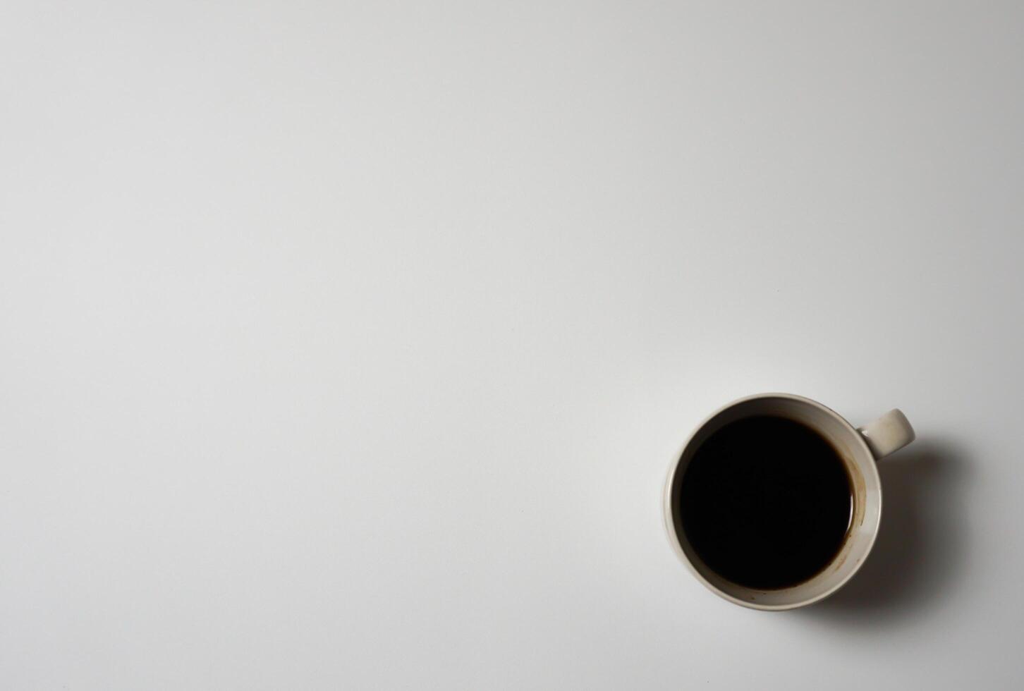 A cup of black coffee on a white background. photo