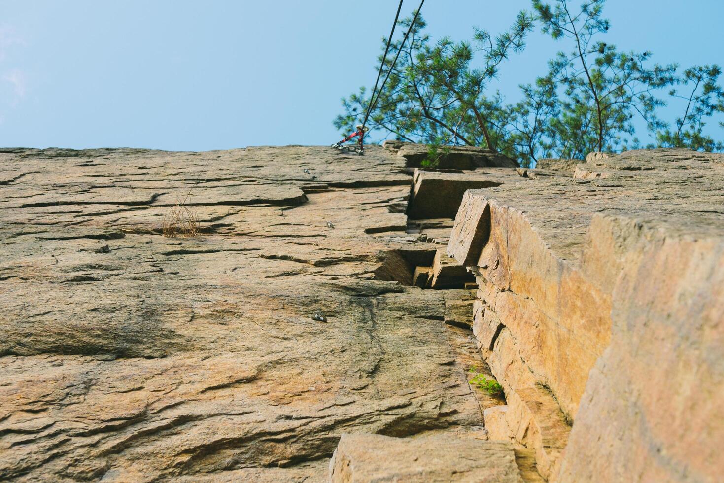 Mountain climbing wall. Training area for outdoor activities. No people. Blue sky. photo